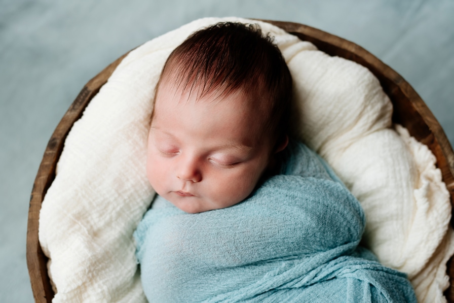 baby blue swaddle for newborn session