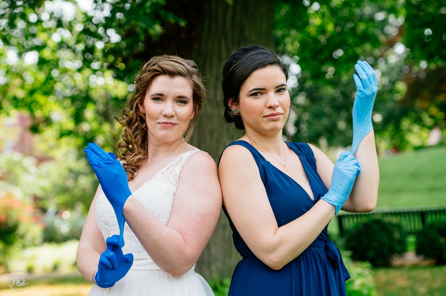 Bride and Bridesmaid posing with rubber gloves 