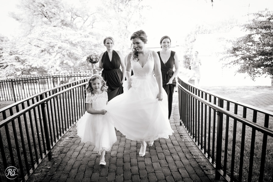 Flower Girl Helping Bride with her Dress