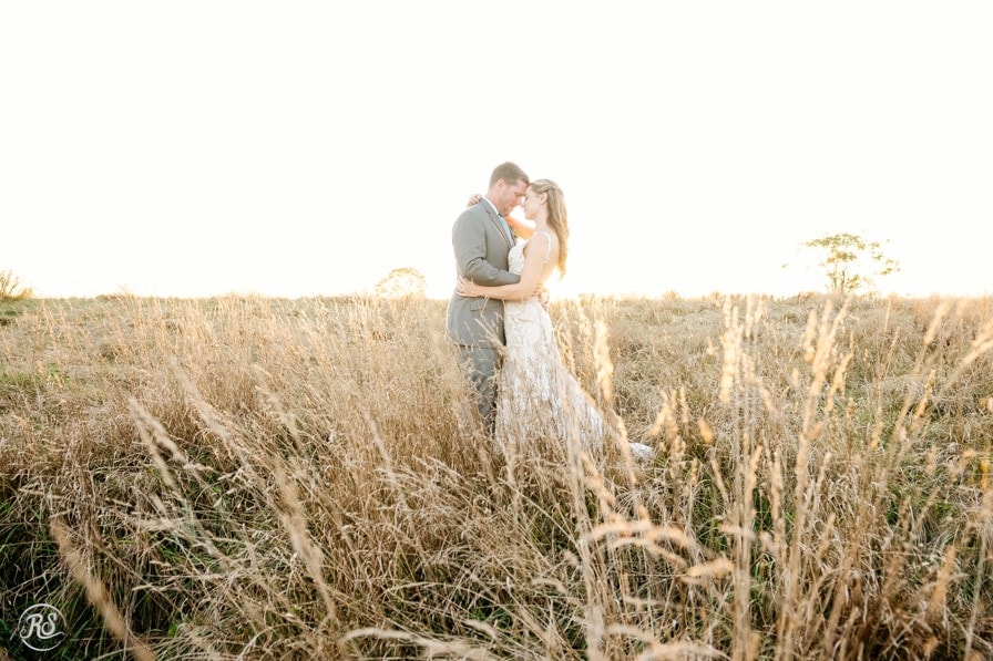 Breathtaking sunset photo of bride and groom 