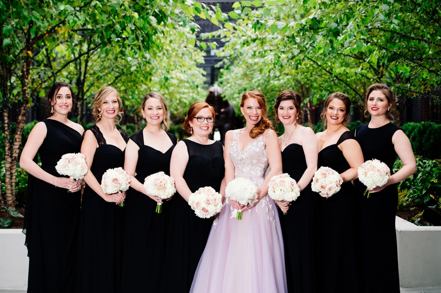 Elegant classy bridesmaids in black gowns