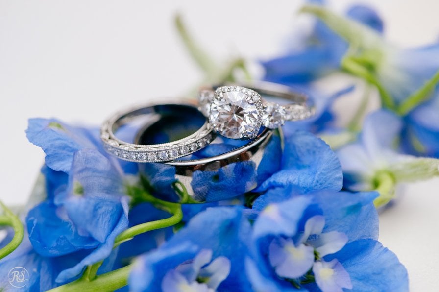 Wedding rings on blue flowers 