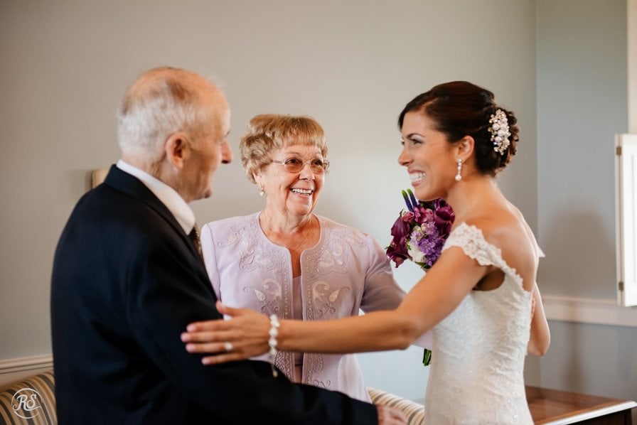Bride laughing with grandparents