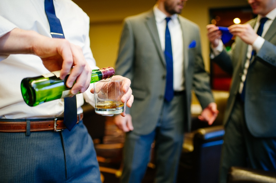groomsmen enjoying cocktails 