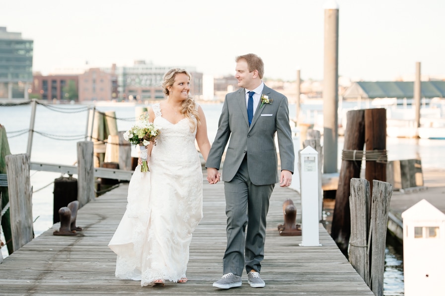 Bride and Groom walking Baltimore Pier 