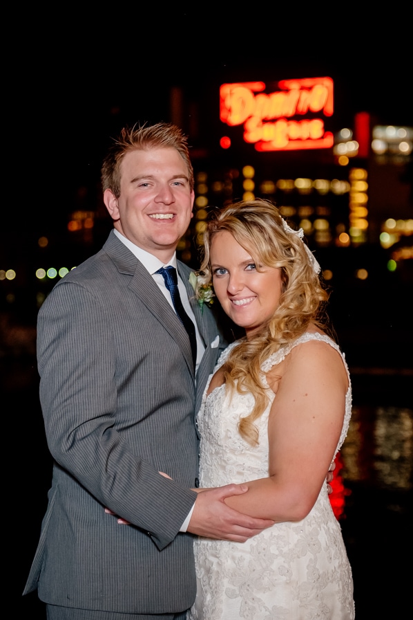 Bride and Groom with the Domino Sugar sign 