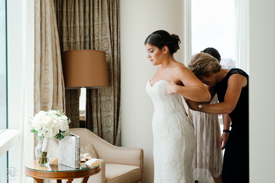 Bride getting dressed at the Four Seasons 