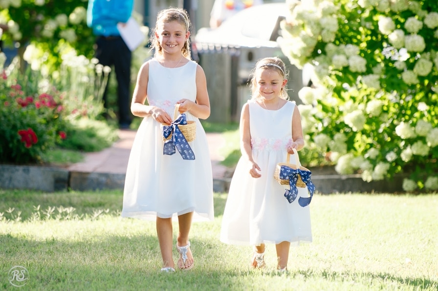 Flower girls walking down the aisle 
