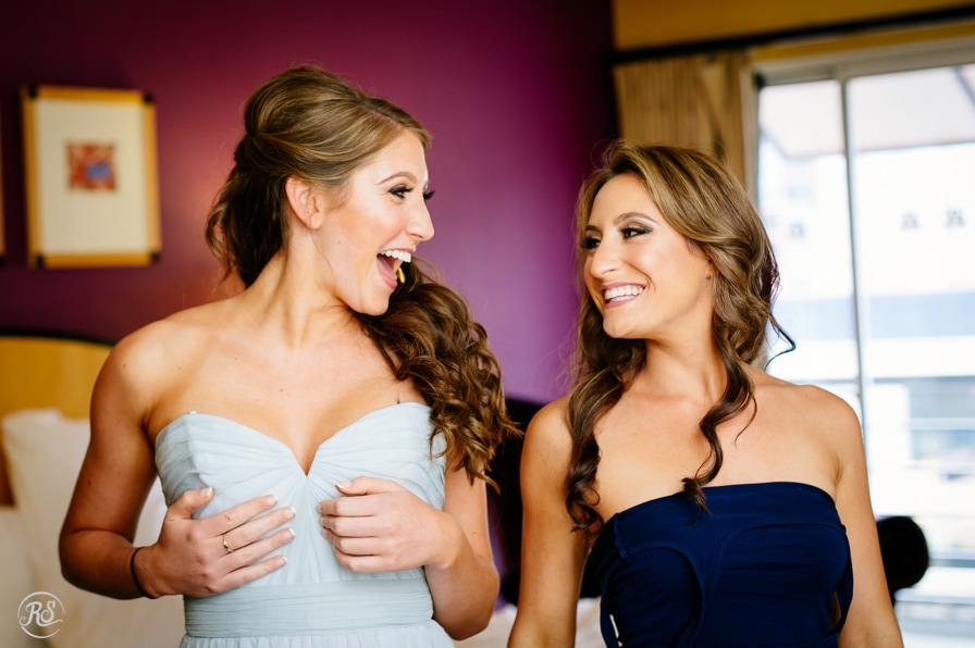 Bride and Bridesmaid laughing together