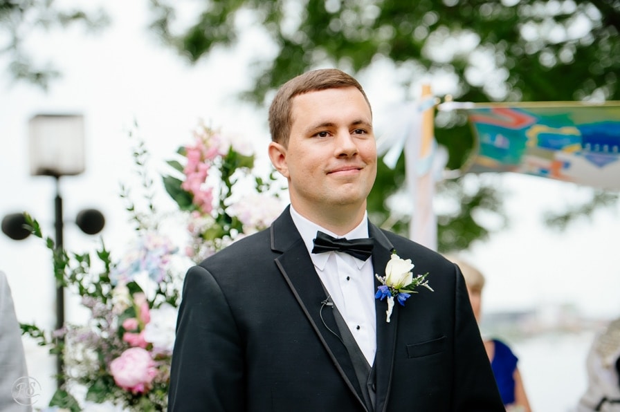 Groom waiting for bride to come down aisle 