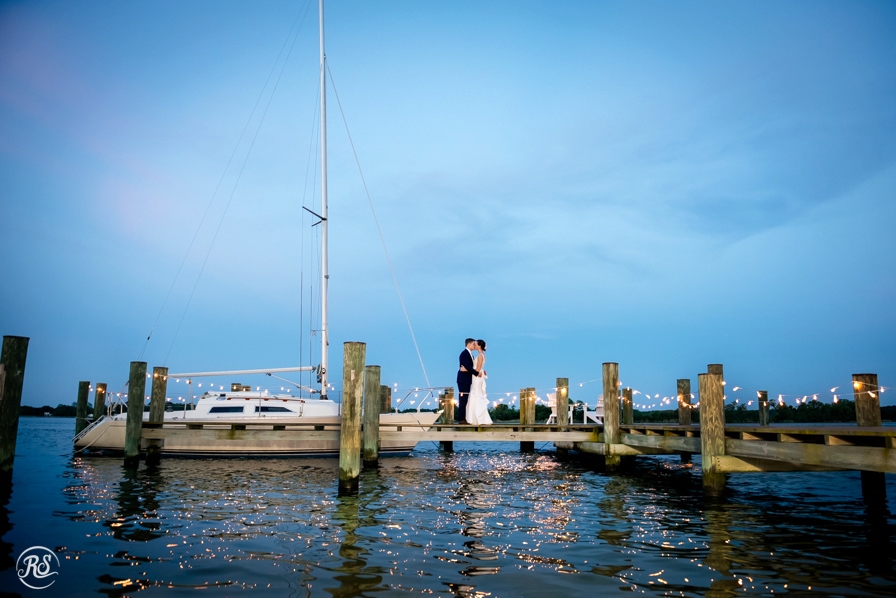 night photos of bride and groom on the water 