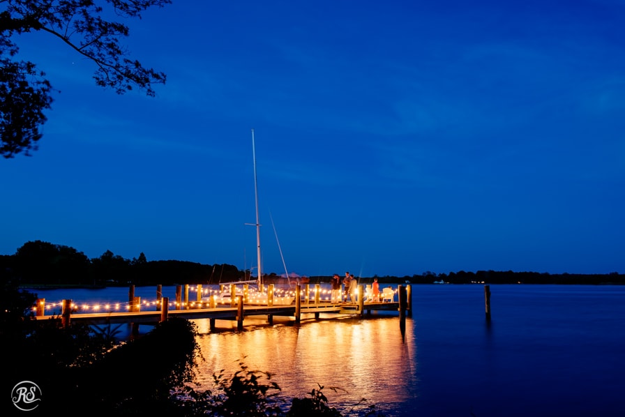waterfront dock light up at night for wedding