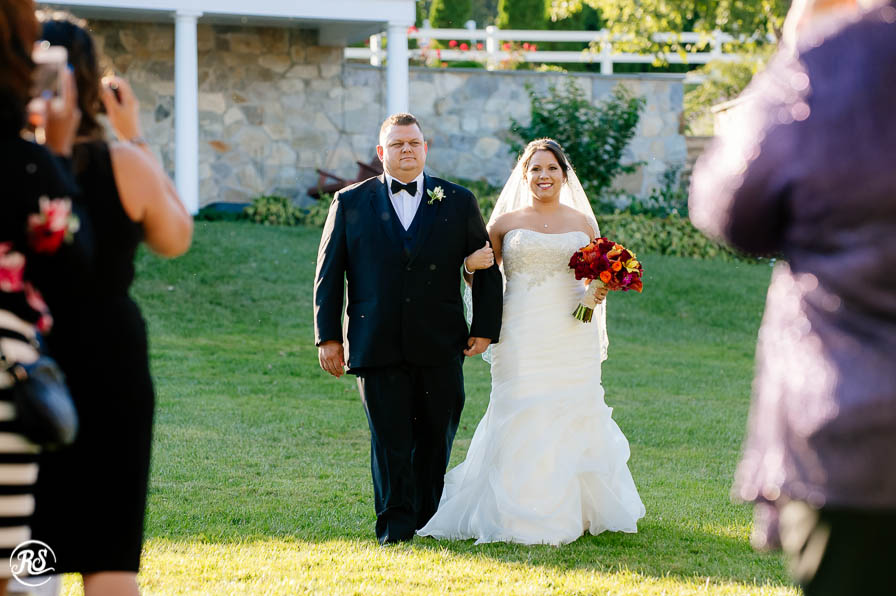 Bride walking down the aisle with brother