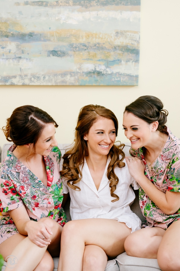 bride with bridesmaids in robes 
