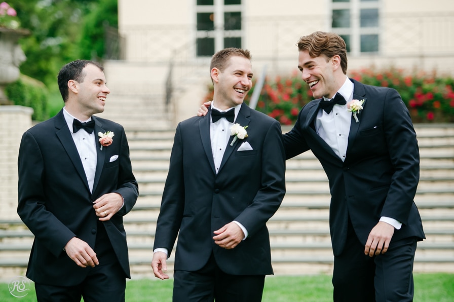 groom hanging out with groomsmen 