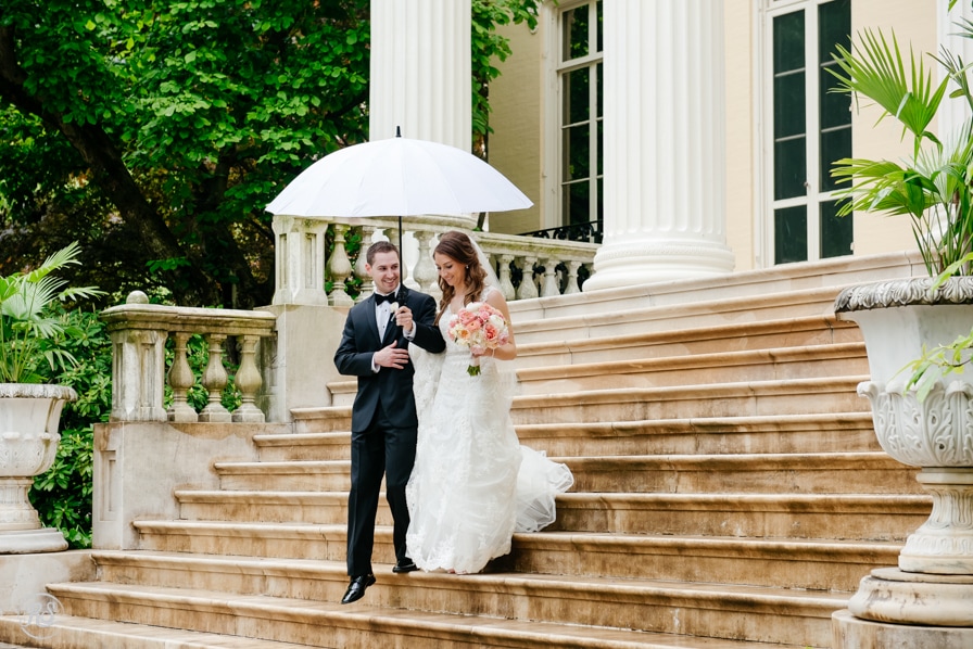 Wedding portraits at the Evergreen Museum in the rain on the steps 