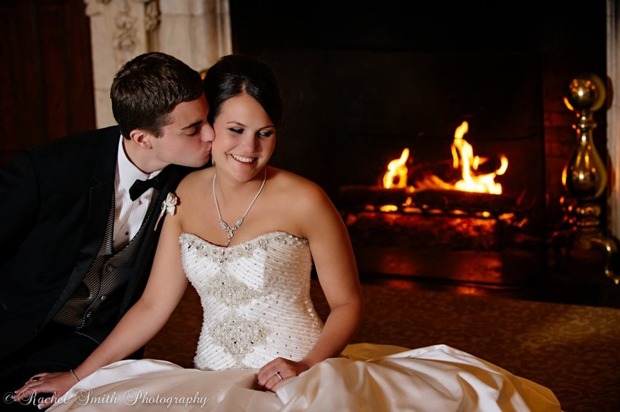Bride and Groom in front of Fireplace
