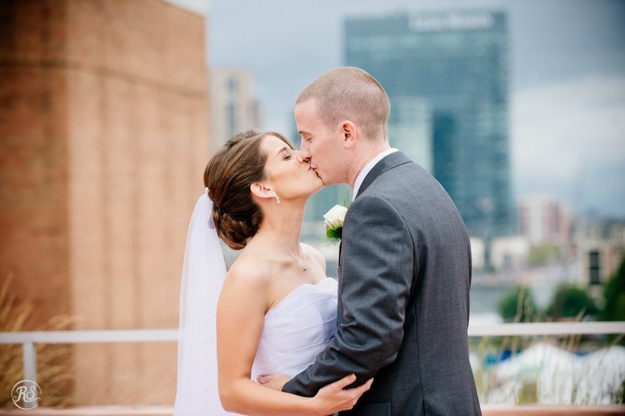Bride and Groom share a kiss at the Maryland Science Center