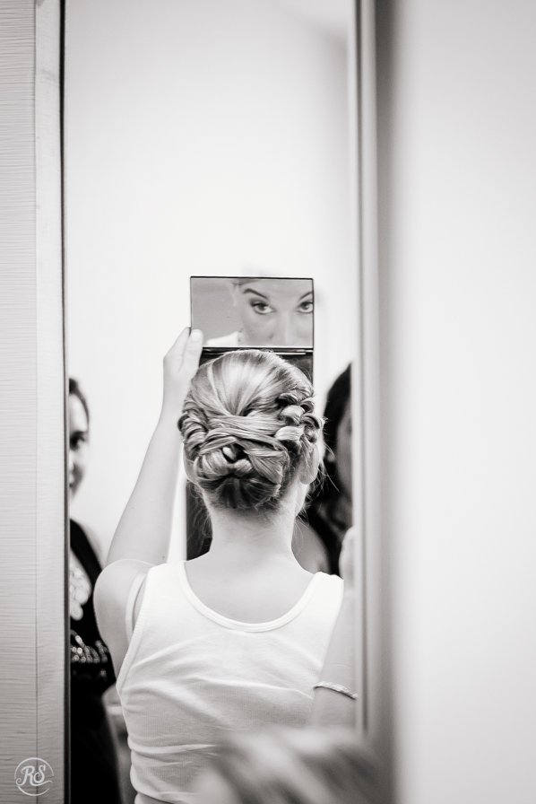Bride looking into mirror 