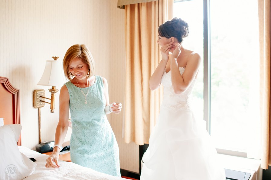 Bride getting ready with the help of mom