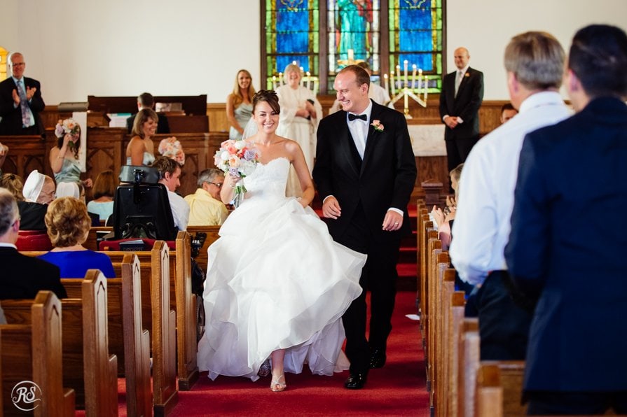 Bride and Groom Walking Down Wedding Aisle 