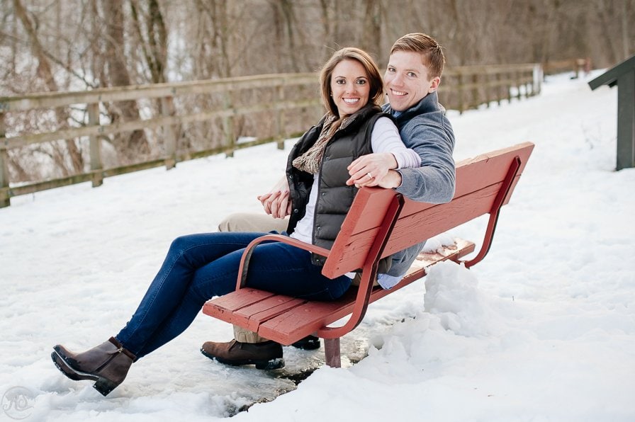 Winter Snow Engagement Photos, Couple on Red Bench