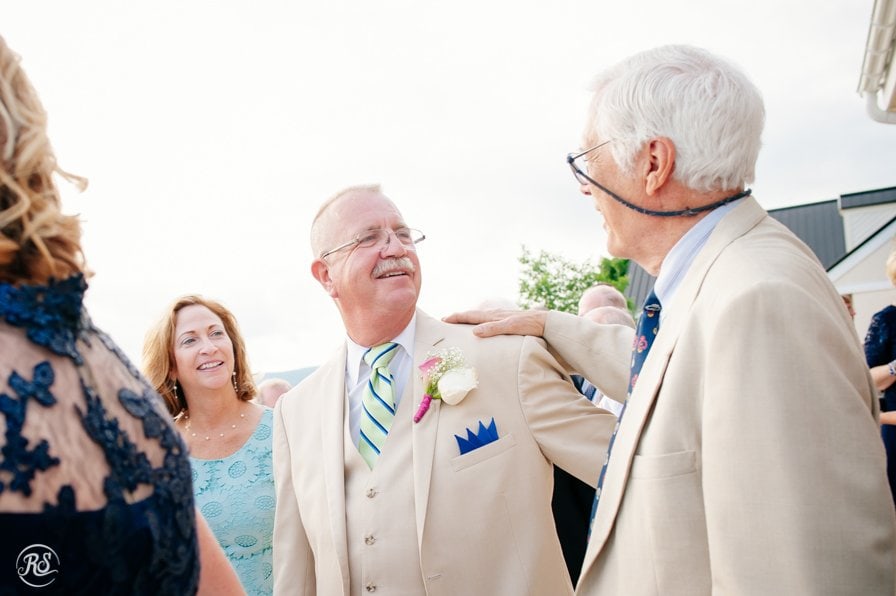 Father of the bride greets guests