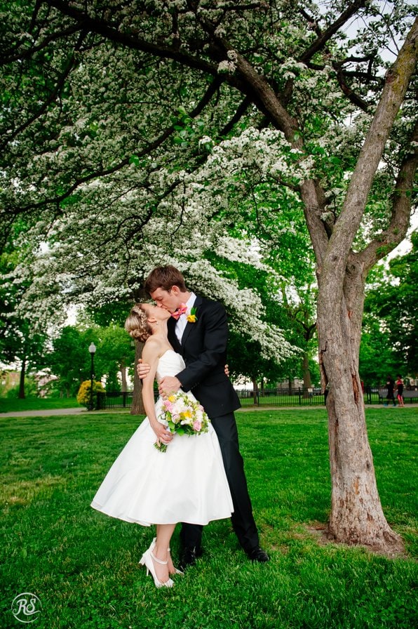 Bride and Groom kiss under a tree