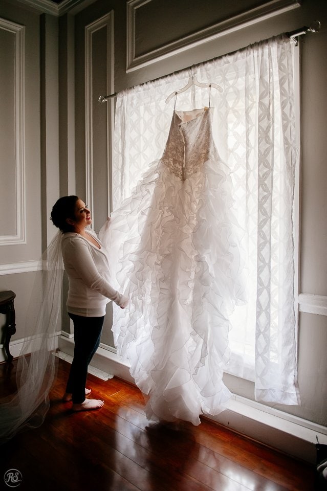 Bride picking her wedding dress