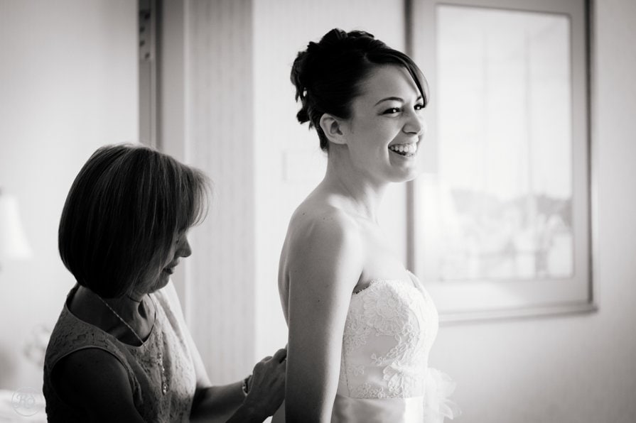 Bride getting ready with the help of her mom