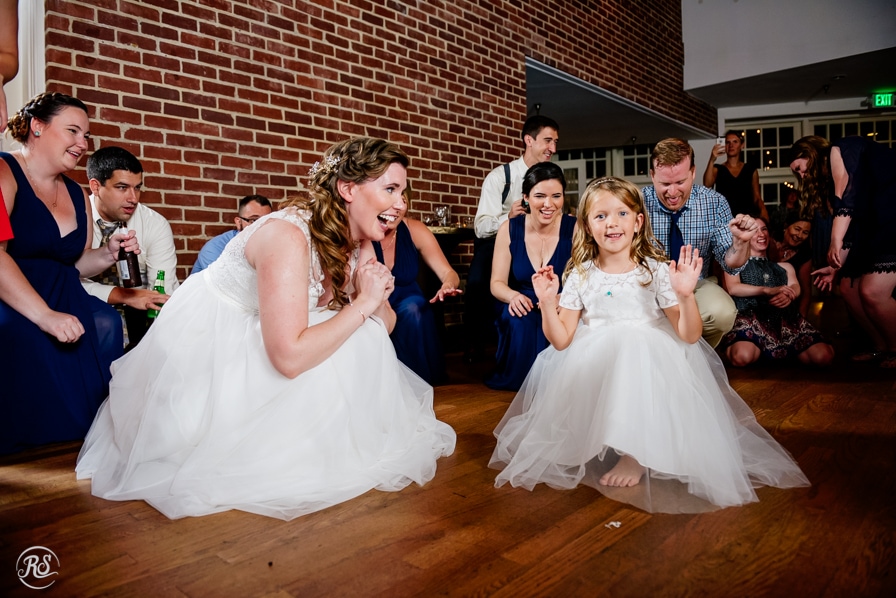 Bride and flower girl dancing to shout