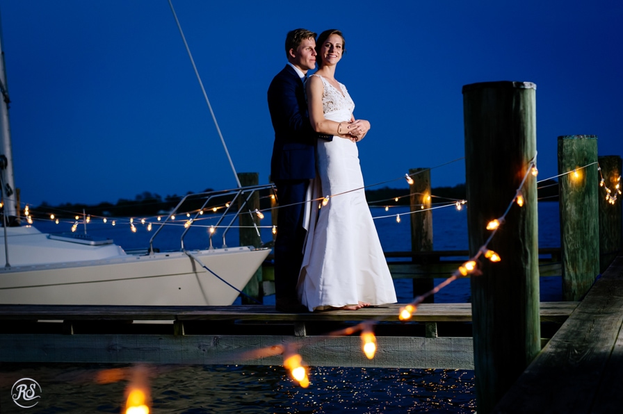 night photos of bride and groom on the dock 