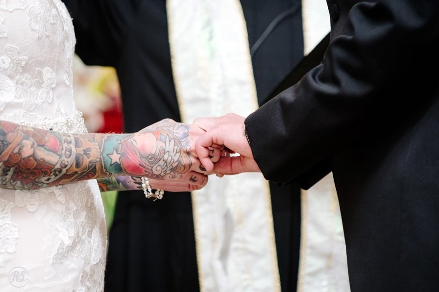 holding hands while saying vows