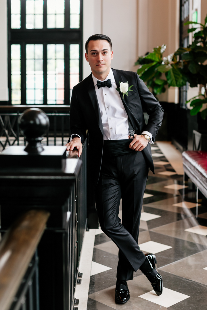 groom in black tie wedding attire at Sagamore Pendrt