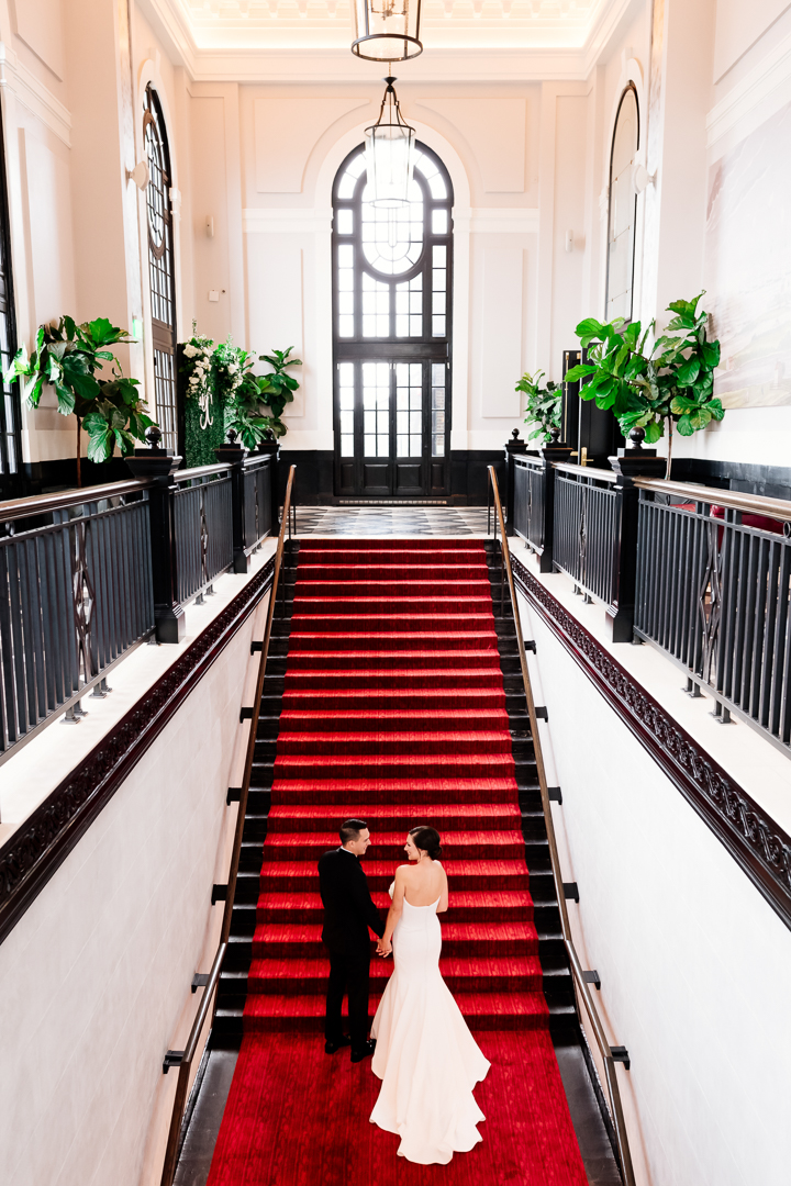 bride and groom on the Sagamore Pendry iconic staircase