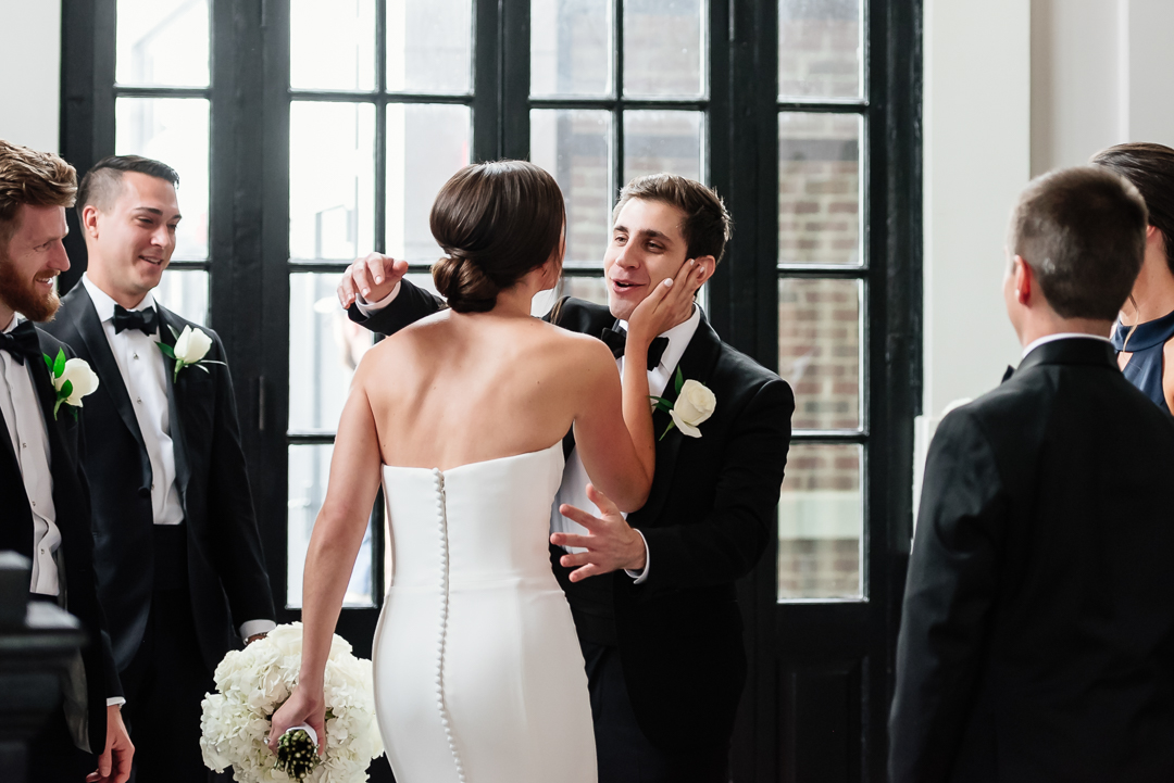 bride greeting groomsmen