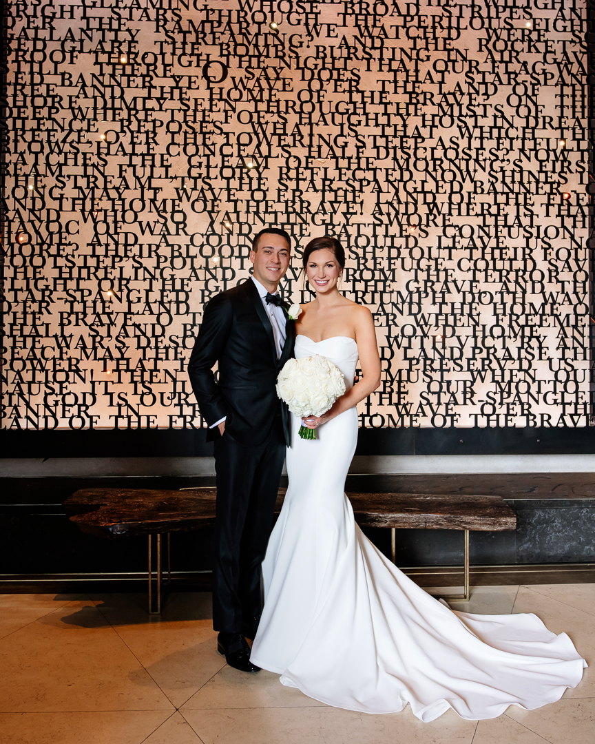 groom and bride portrait with modern backdrop