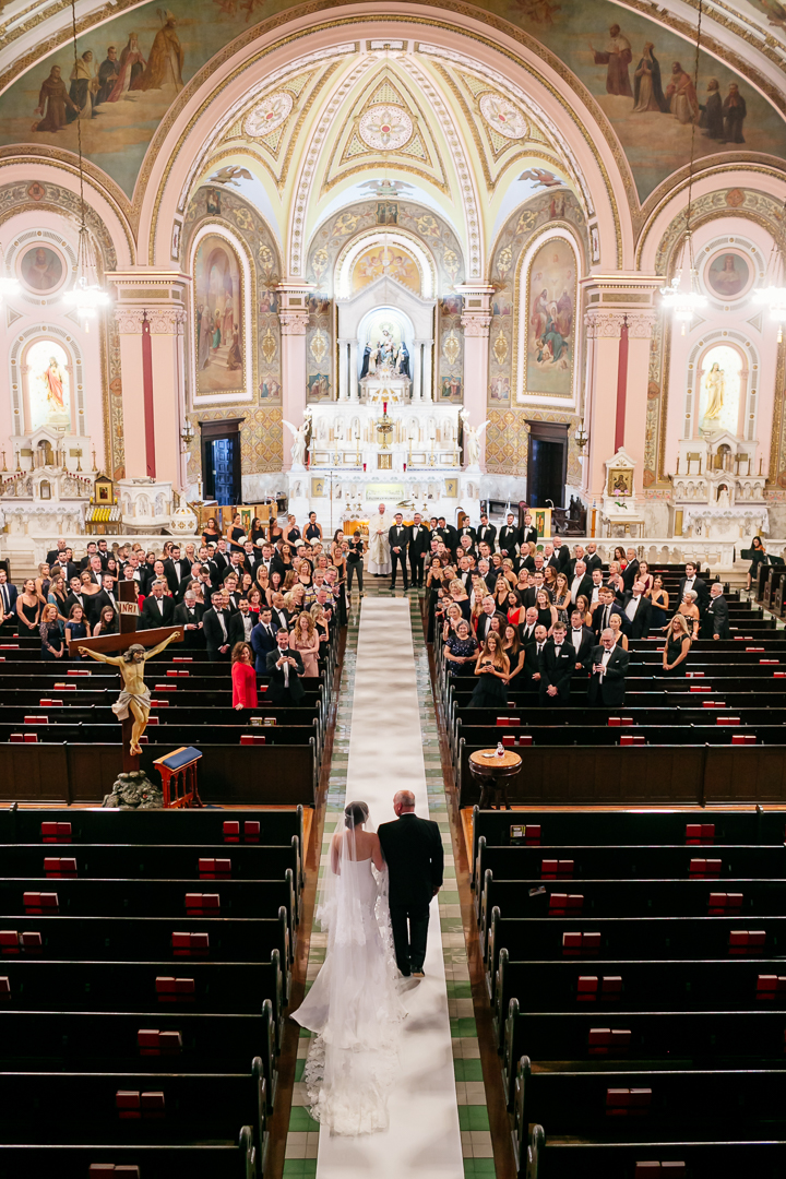balcony view of bride walking down aisle