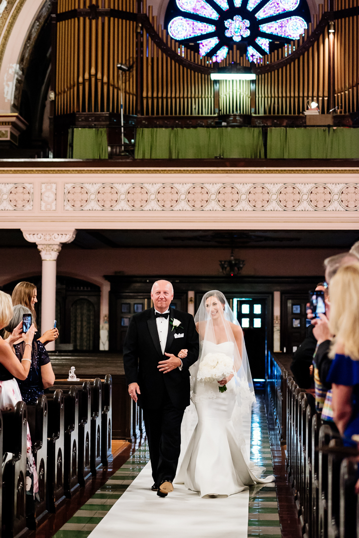father of the bride walking bride down the aisle