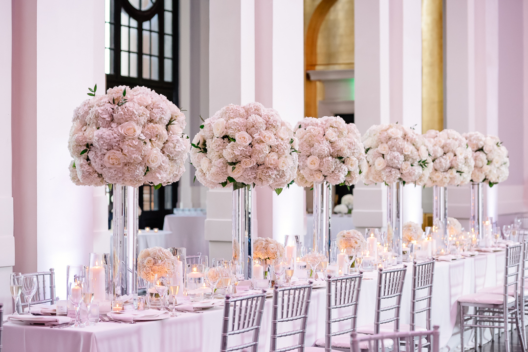elaborate white floral centerpieces in the sagamore pendry hotel ballroom