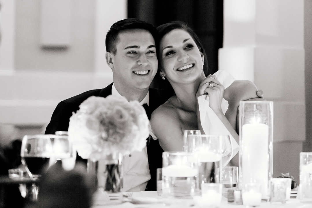 candid of bride and groom having a great time at their wedding