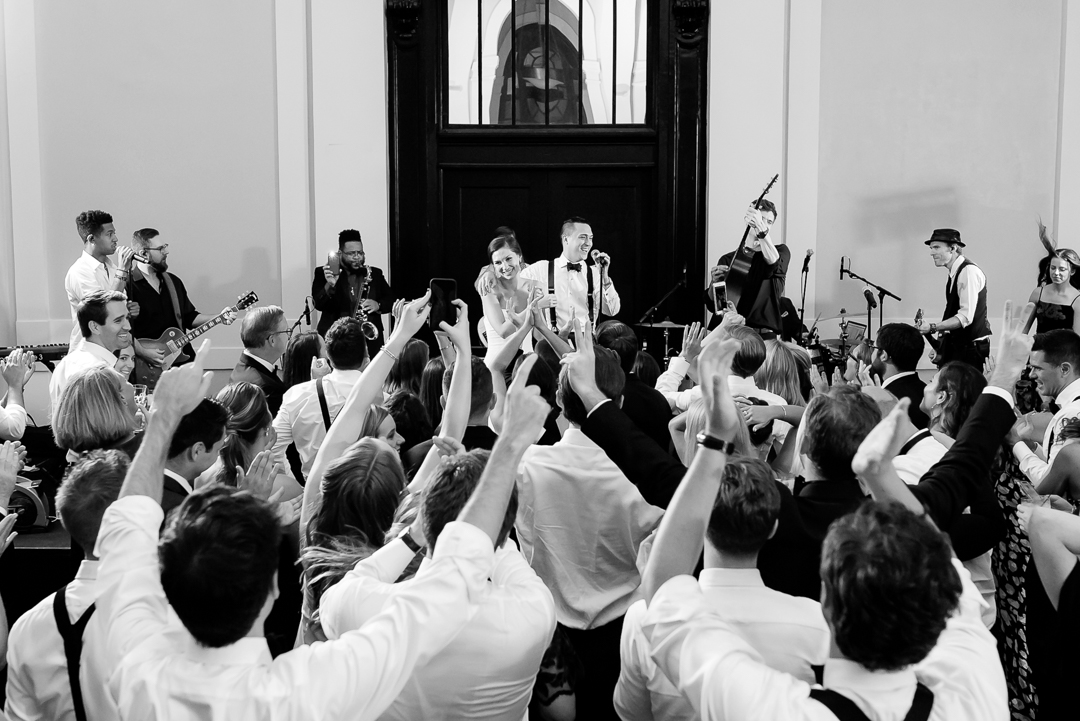 bride groom singing with wedding band