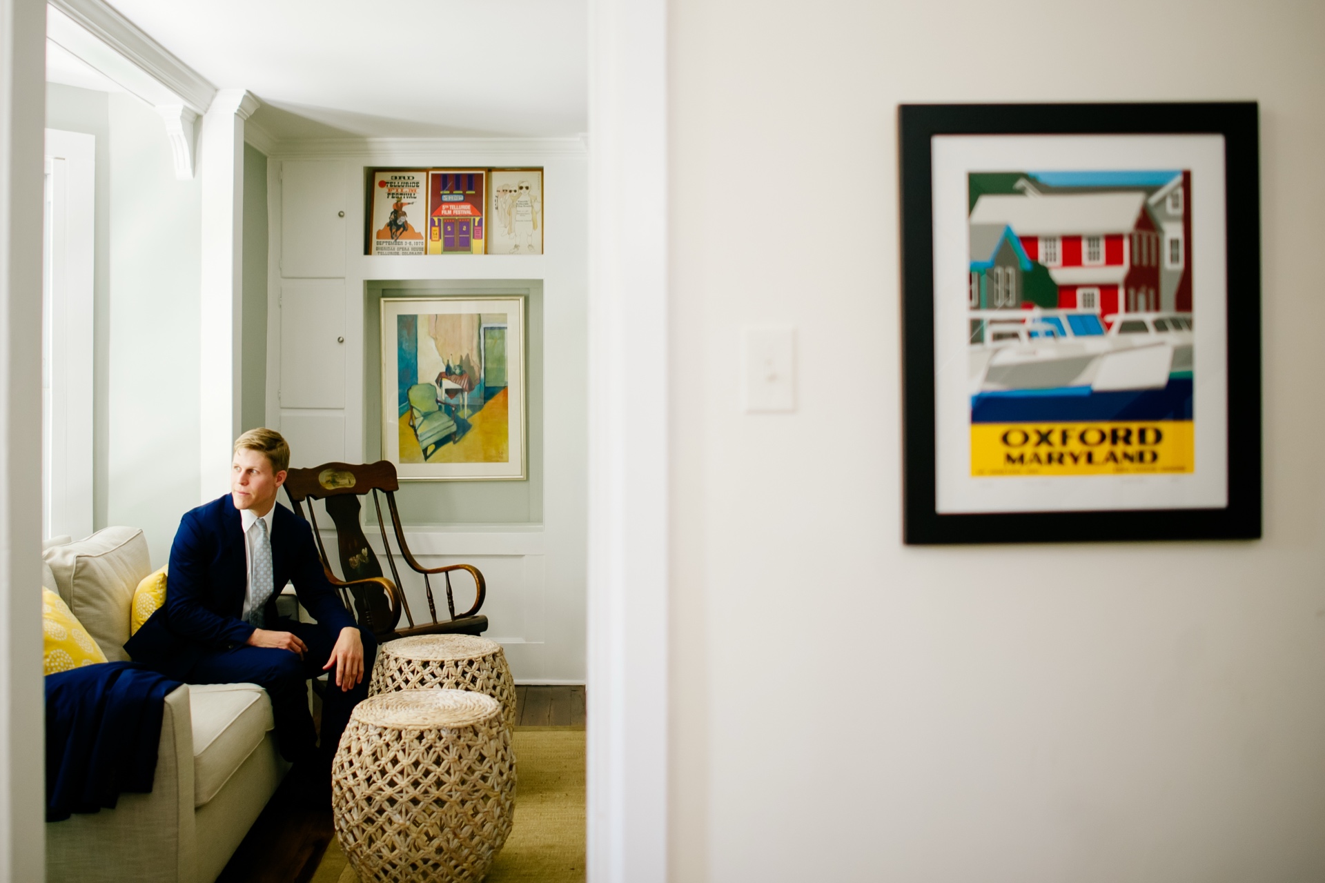 groom looking out window before wedding ceremony